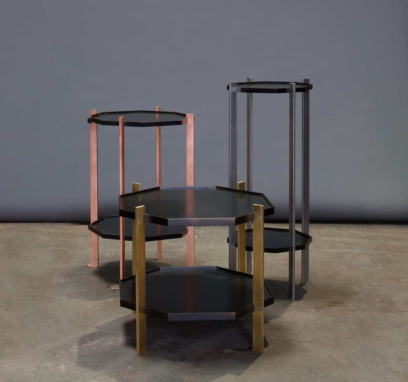 Three octagon shaped end tables with various metallic legs in copper, steel, and gold metallic finish.