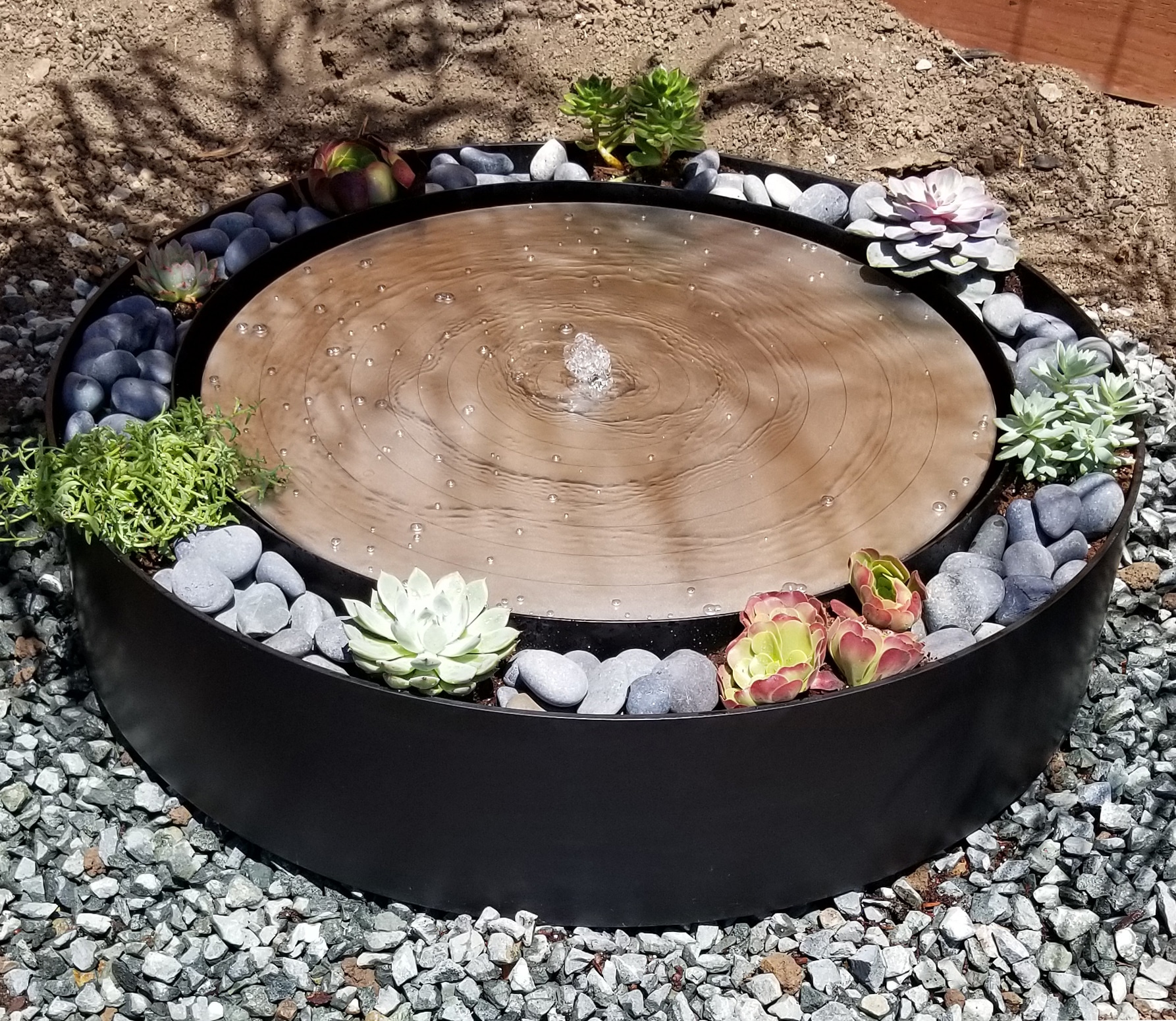 circular steel water fountain, outdoor, portfolio